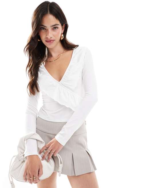 ASOS DESIGN frill wrap top with ruffle cuff in ivory