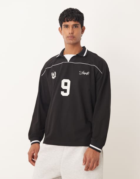 ASOS DESIGN – Fußball-Polohemd in Schwarz mit Oversize-Passform und Paspelierung - view 1
