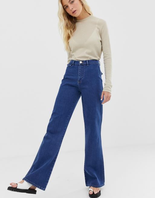 Asos Design Full Length Flare Jeans With Pressed Crease And Western Pockets In Mid Vintage Wash Asos