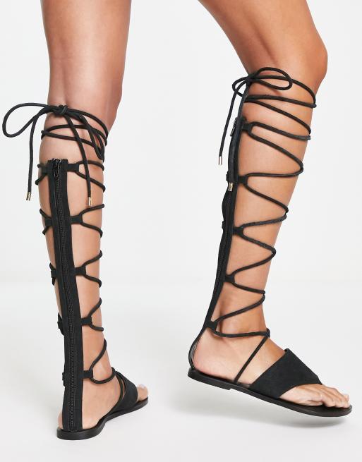 ASOS DESIGN Full Moon suede knee high gladiator sandals in black