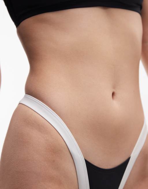 ASOS DESIGN Fuller Bust Cordelia Exclusive contrast high leg bikini bottoms in black and white, 3 of 4