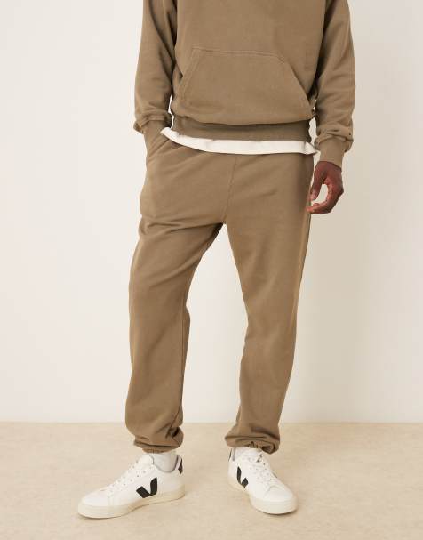 ASOS DESIGN garment dye heavy wash tapered fit trackies in khaki (Part of a set) - view 1