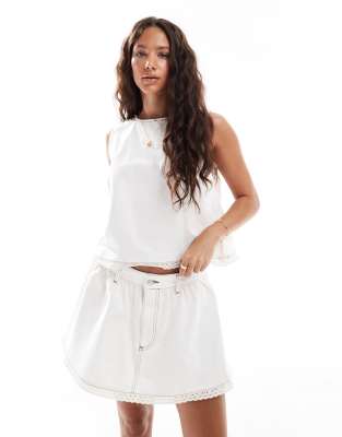 gathered denim micro skirt with eyelet trim in ecru-White