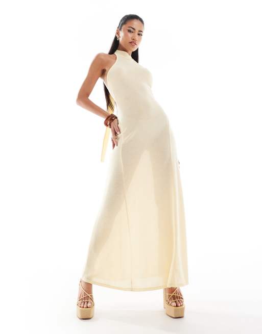ASOS DESIGN - Gebreide maxi-jurk met halternek, godetplooien en gestrikte achterkant in karnemelkkleur