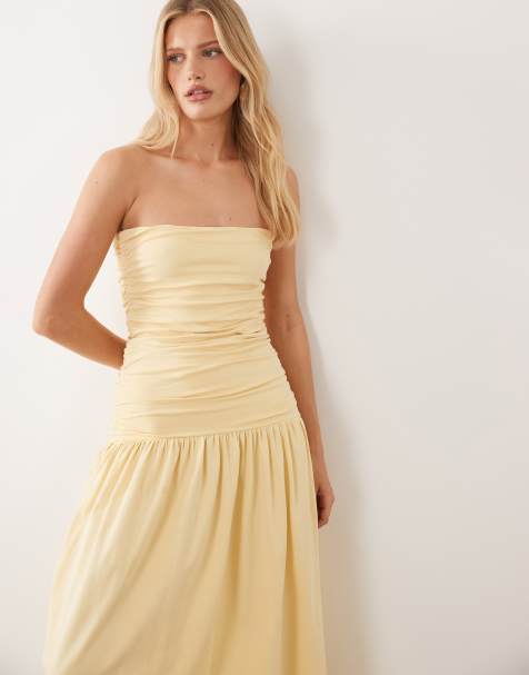 ASOS DESIGN – Gerafftes, trägerloses Maxikleid in Buttermilchgelb mit tiefer Taille - view 1