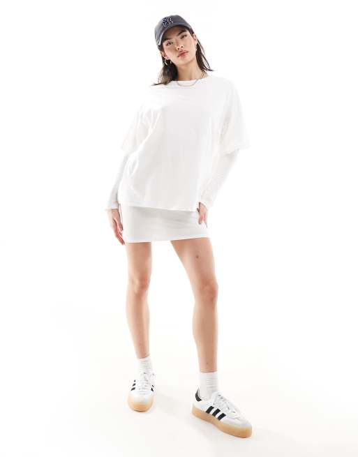 ASOS DESIGN - Geribbelde hoogsluitende mini T-shirtjurk met lange mouwen en overlay in stone