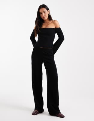 ASOS DESIGN - Gerippte, angeraute Hose in Schwarz mit weitem Bein, Kombiteil