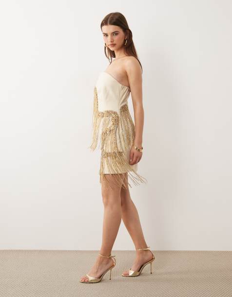 ASOS DESIGN – Geschwungenes, trägerloses Minikleid in Cremeweiß mit goldfarbenen Fransen - view 1