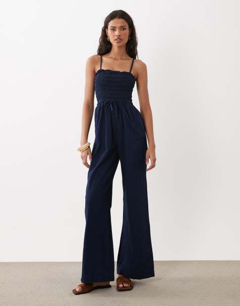 ASOS DESIGN - Gesmokte denim jumpsuit in inktblauwe wassing - view 1