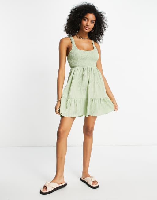 ASOS DESIGN - Gesmokte mini-zonnejurk met stroken en gestreepte textuur in saliegroen