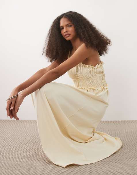 ASOS DESIGN – Gesmoktes Midi-Sommerkleid in Buttermilchgelb mit schmalen Trägern - view 1