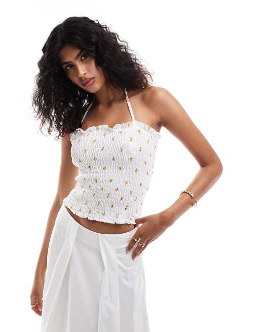 ASOS DESIGN – Gesmoktes Neckholder-Top in Weiß mit Zitronen-Blümchenprint