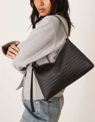 ASOS DESIGN - Gesteppte Schultasche in Schwarz mit Riemen mit seitlichem Schnallendetail