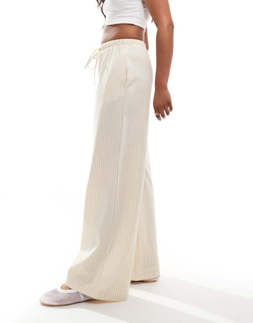 ASOS DESIGN - Gestreepte broek met wijde pijpen en gestrikte taille in stone