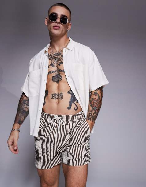 ASOS DESIGN - Gestreepte korte zwemshort van seersuckerstof in bruin - view 1