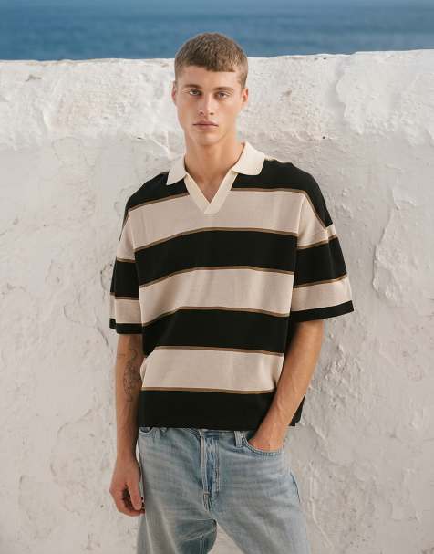 ASOS DESIGN – Gestreiftes Relaxed-Fit-Polohemd aus Strick in Schwarz und Steinbeige - view 1