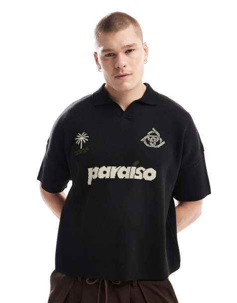 ASOS DESIGN – Gestricktes, kastiges Oversize-Polohemd in Schwarz mit „Paraiso“-Print auf der Brust - view 1