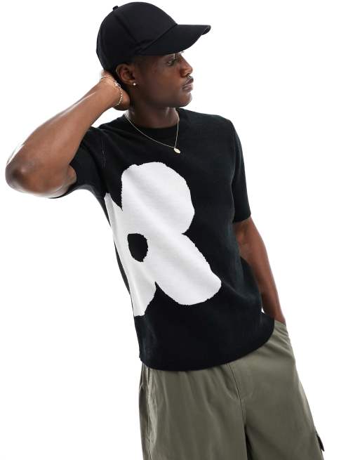 ASOS DESIGN – Gestricktes T-Shirt in Schwarz mit weißem Blumenmotiv