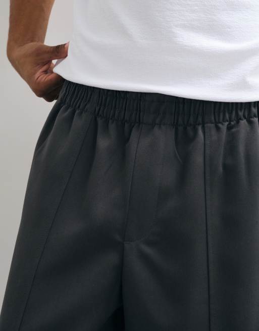 ASOS DESIGN - Getailleerde elastische oversized toelopende broek in antracietgrijs, 5 van 5