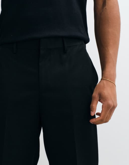 ASOS DESIGN getailleerde toelopende broek in zwart met elastische taille en omslag, 3 van 5
