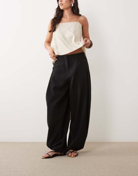 ASOS DESIGN - Getailleerde toelopende broek met drukknopen aan de zoom in zwart - view 1