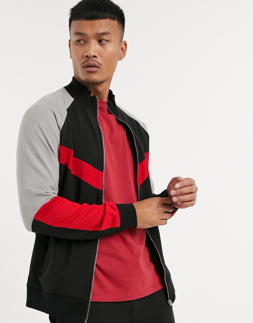 ASOS DESIGN - Giacca sportiva in tricot di poliestere con dettagli in rete color block in coordinato-Nero