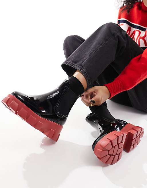 ASOS DESIGN Giana chunky chelsea rain boots in black and red ASOS DESIGN Giana chunky chelsea rain boots in black and red