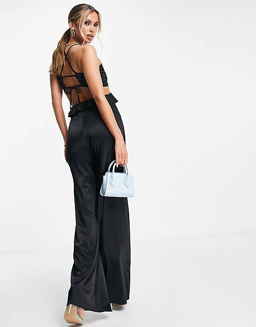 Women glam strappy cut out satin frill jumpsuit in black 
