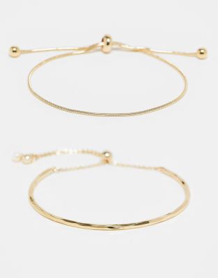 ASOS DESIGN - Goldfarbene Armbänder im 2er-Pack mit Knebel-Verschluss