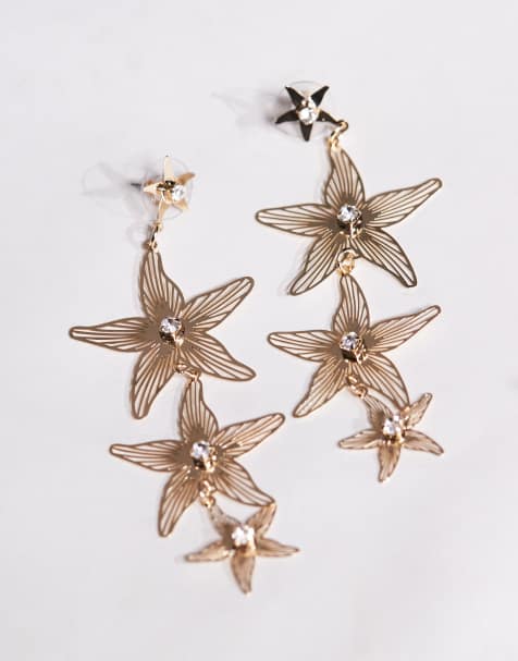 ASOS DESIGN – Goldfarbene Hängeohrringe im Seestern-Design mit Schmucksteinen - view 1