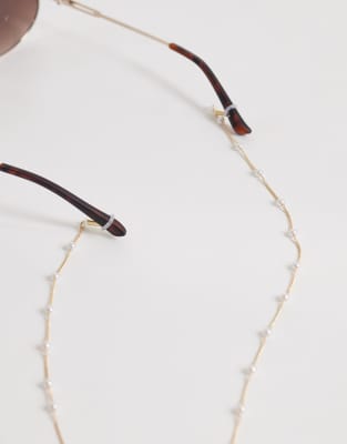 ASOS DESIGN - Goldfarbene Sonnenbrillenkette mit Bahnendesign mit Kunstperlen