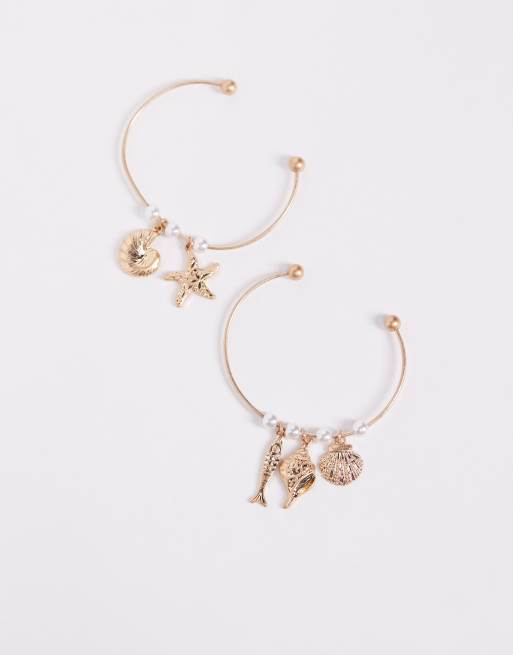 ASOS DESIGN – Goldfarbener Armreif im Zweierpack mit Meerestiere-Anhänger, 2 von 3