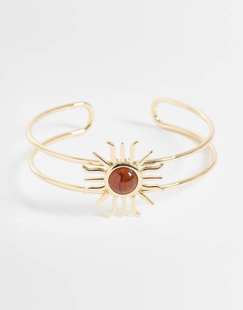 ASOS DESIGN – Goldfarbener Wickel-Armreif mit Sonnen-Design und bernsteinfarbenem Stein - view 1