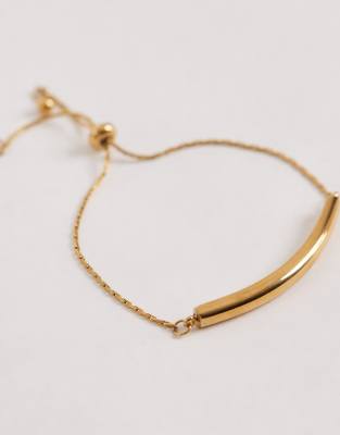 ASOS DESIGN - Goldfarbenes Armband aus wasserfestem Edelstahl mit Knebelverschluss und Geschenkbeutel