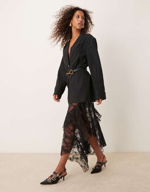 ASOS DESIGN - Gonna midi morbida in pizzo nero con orlo asimmetrico e volant
