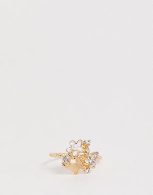 ASOS DESIGN - Goudkleurige ring met vlinder en kristallen bloem