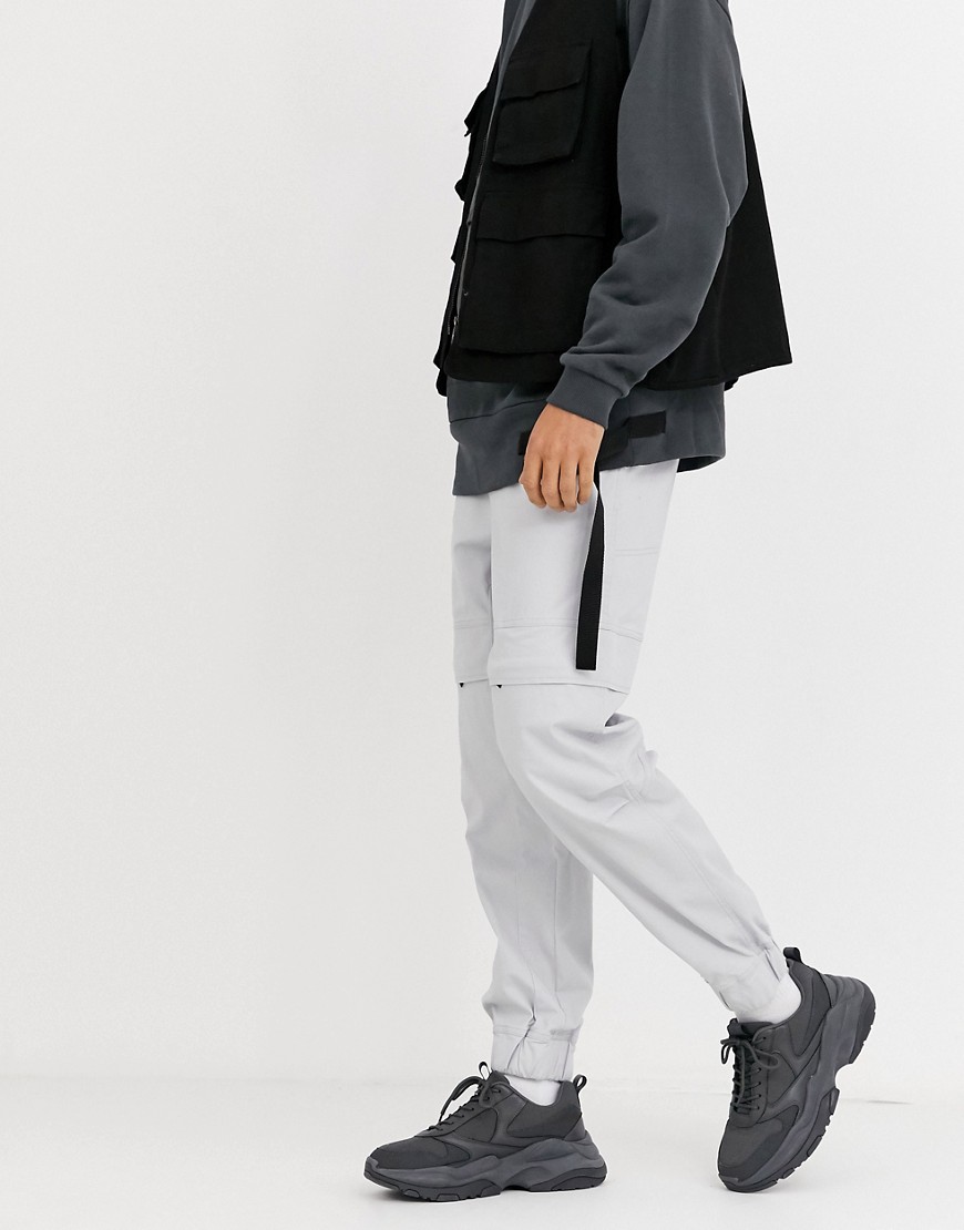 ASOS DESIGN – Grå avsmalnande byxor i oversize-modell med dolda fickor