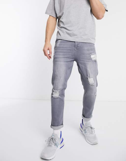 ASOS DESIGN - Grå tapered jeans med slitage