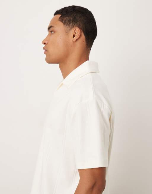 ASOS DESIGN – Gräddvit, ribbad, texturerad pikétröja med avslappnad, boxig passform och platt krage, 4 av 5