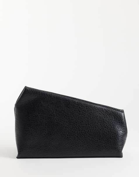 ASOS DESIGN grainy asymmetric clutch in black - view 1