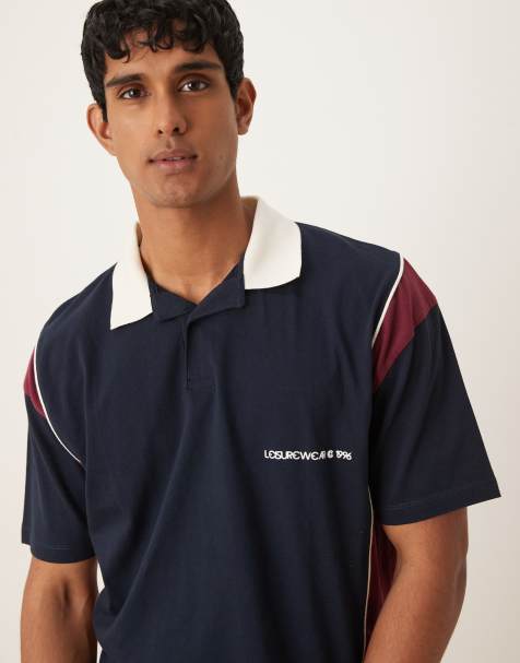 ASOS DESIGN boxy oversized polo with chest print in navy