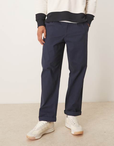 ASOS DESIGN – Granatowe chinosy o luźnym, zwężanym kroju z zakładkami - view 1