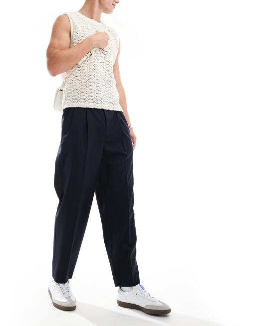 ASOS DESIGN – Granatowe spodnie oversize ze zwężanymi nogawkami i podwójnymi zakładkami