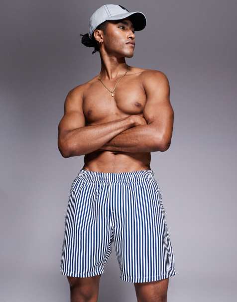 ASOS DESIGN swim shorts in mid length in navy stripe