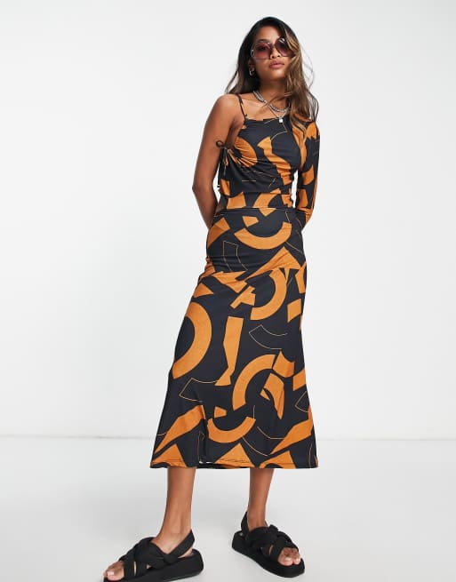 ASOS DESIGN – Granatowo-pomarańczowa sukienka midi na jedno ramię z ozdobnym wycięciem i geometrycznym wzorem