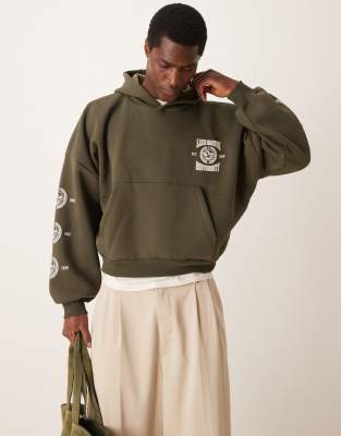 ASOS DESIGN – Grön, kort huvtröja i oversize med sänkt axelsöm och tryck - view 1