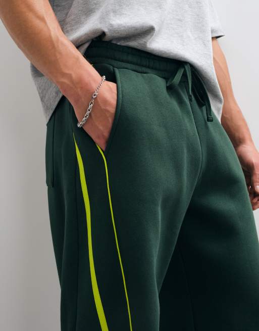 ASOS DESIGN – Gröna mjukisbyxor i cocoon-modell med revärer, 4 av 9