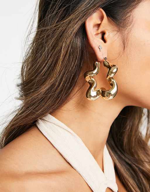 ASOS DESIGN - Grote los gedraaide oorringen in goudkleur