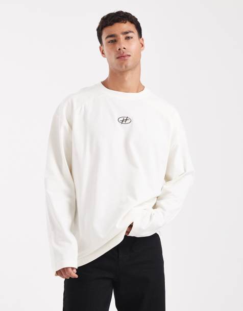  ASOS DESIGN heavyweight  oversized long sleeve t-shirt with printed chest badge and cut a sew detail in cream 