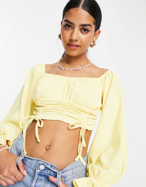 ASOS DESIGN – Gul off shoulder-topp